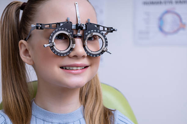 istock Fair-haired school age girl having an optometry test in clinic 2212404904