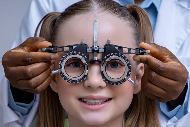 istock Close up of doctor adjusting optometric tool for vision check 2212404971