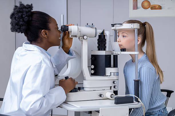 istock Ophthalmologist checking girls vision by using optical medical equipment 2212405012