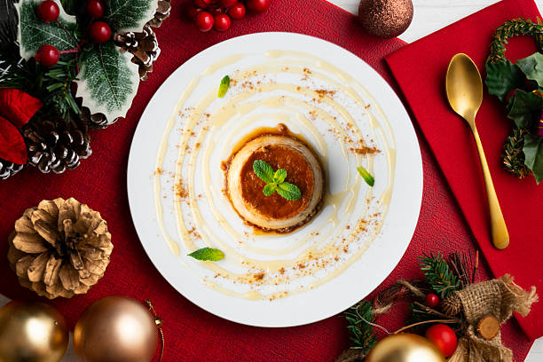 istock Egg flan with homemade Spanish recipe. Top view table with christmas decorations. 2212406071