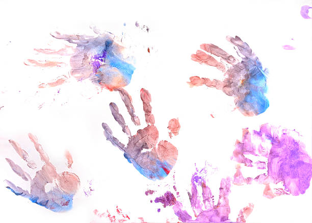 istock Colorful children's hand prints on a white background. 2212406482