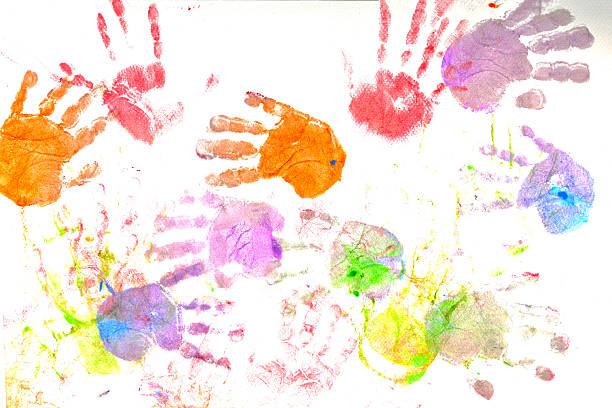 Colorful children's hand prints on a white background.