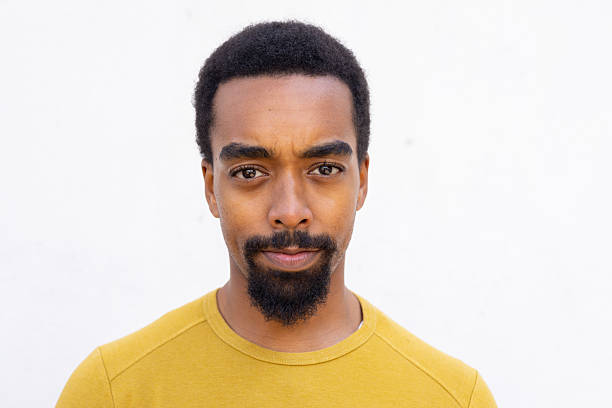 istock Portrait of a serious young black man staring at camera with neutral expression 2212408047