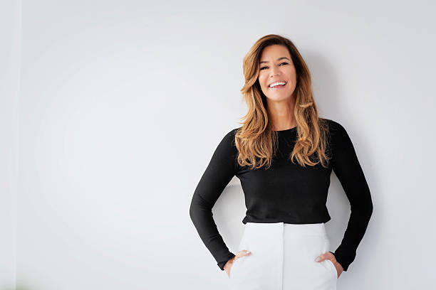 Confident businesswoman against white background