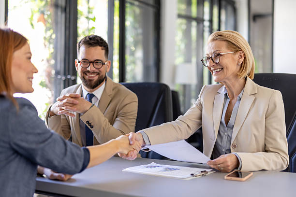 istock Professional Team Celebrating Candidate in Job Interview 2212411022