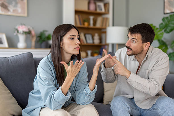 istock Couple Engaged in Conflict Resolution Amidst Home Comfort 2212411512