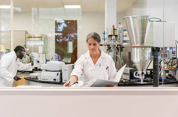 istock Scientist reviewing data in a modern laboratory 2212414135