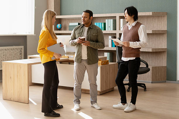 istock Diverse business team discussing during a coffee break in the office 2212414581