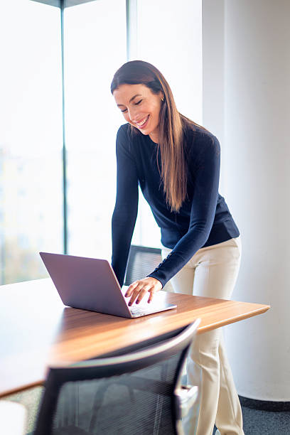 istock Businesswoman using her laptop in a modern office 2212414645