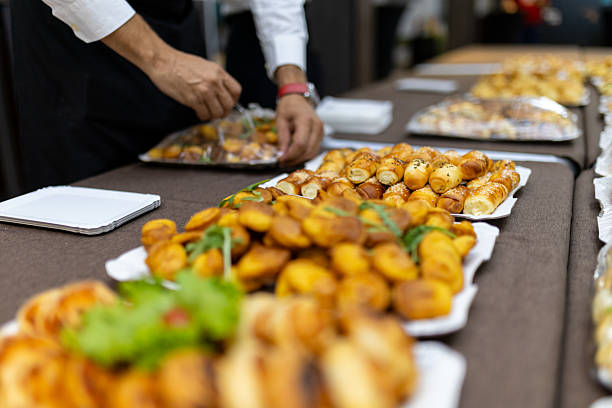 istock Catering service sets up a lavish spread of assorted appetizers at a formal event 2212415385