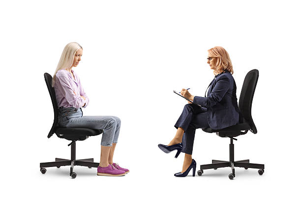 istock Sad young woman discussing a problem with a female boss 2212415554