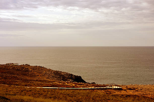 Morning view of Praia dos Três Castelos in Portimão, Algarve, Portugal – golden cliffs, calm waves, and peaceful beach atmosphere.