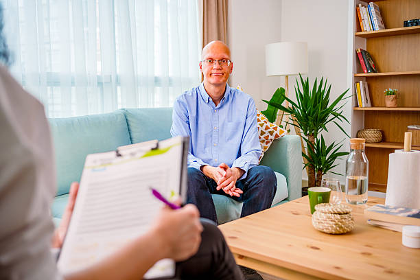 istock Man Speaking with Therapist During Counseling Session 2212418609