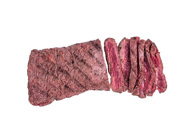 istock Grilled and sliced Flank beef steak, BBQ meat isolated on white background. top view 2212419991