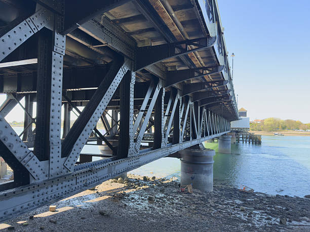 istock Road Bridge Over Tidal Flats Linking Island To Mainland 2212422072