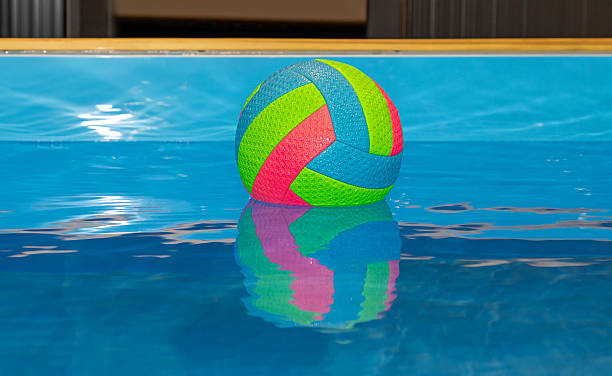 istock Colorful ball in water pool 2212424477