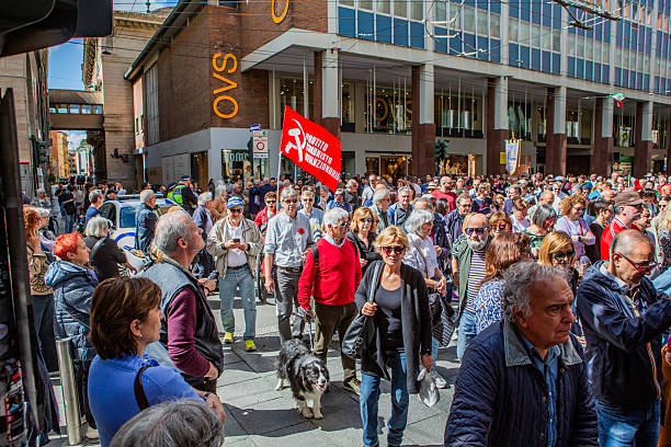 This photo was shot in mid March 2025, in the downtown of Dusseldorf, Germany and depicts a relatively large crowd of people, making the streets lively and picturesque.