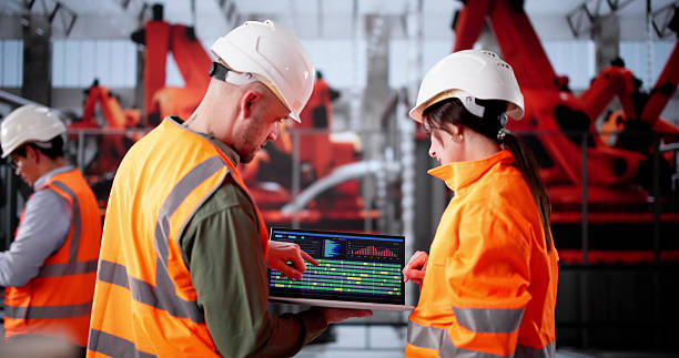 istock Young Latino Engineer Inspecting Semiconductor Equipment 2212430303