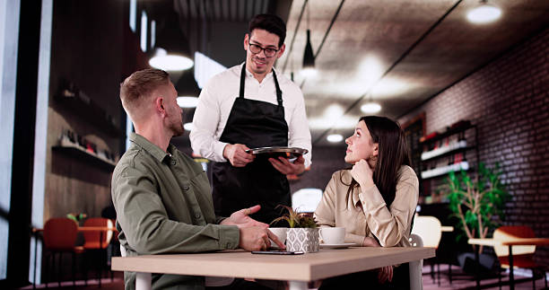 istock Frustrated Hispanic Couple Argue With Manager Over Poor Service 2212430420