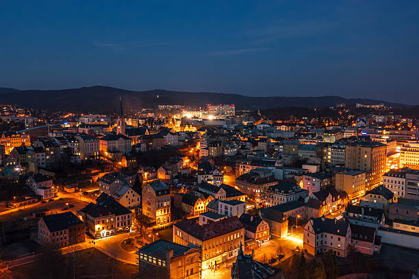 Evening skyline cityscape of Liberec, Czech Republic. Panoramic aerial view of the old town main square and city hall at blue hour