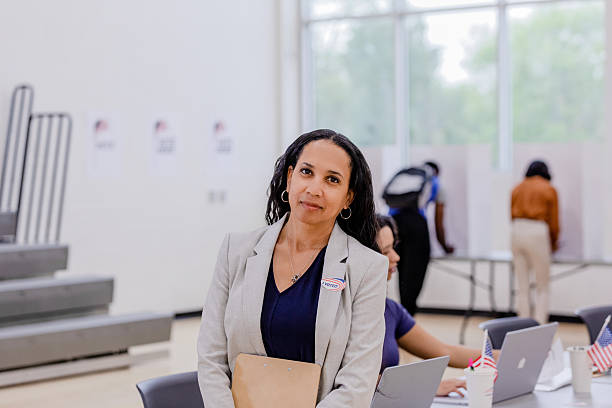 istock Confident Woman in Blazer at Voting Precinct 2212431603