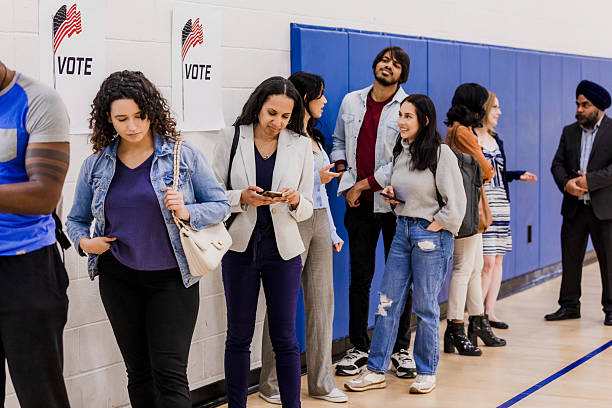 istock Diverse Voters Line Up at Polling Place 2212431617