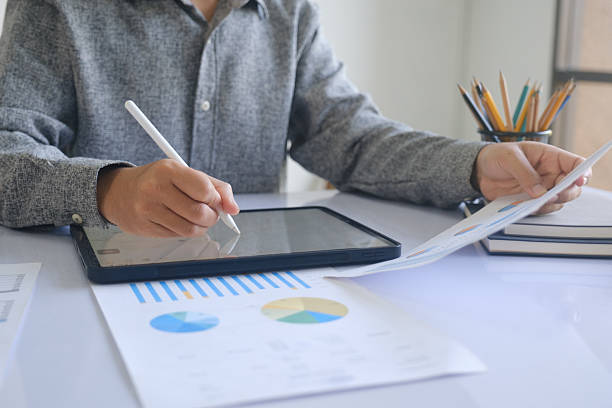 istock Professional businessman analyzing financial graphs investment marketing data. 2212433226