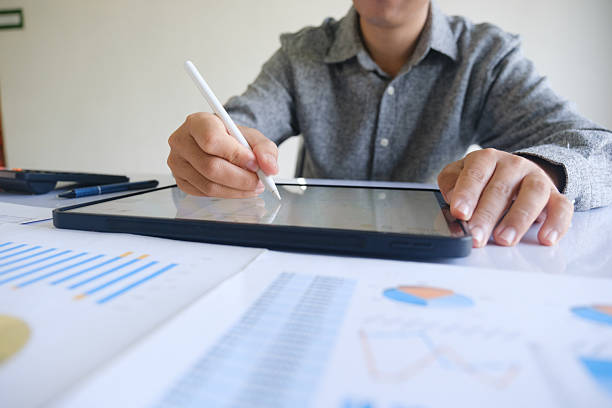 istock Professional businessman analyzing financial graphs investment marketing data. 2212433264