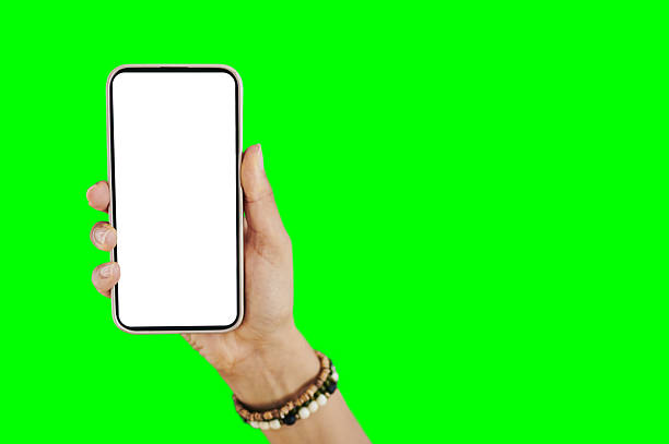 istock Hand Holding Smartphone With Blank White Screen Against Green Screen Background 2212434993
