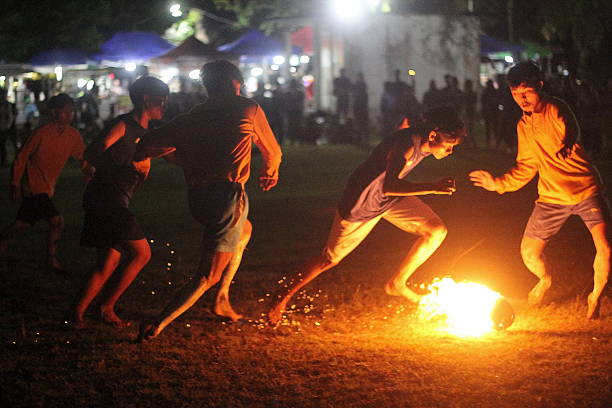 Palangka Raya City, Central Kalimantan Province, Indonesia - April 24, 2025 - Dayak tribe fire football match at the Isen Mulang cultural festival in Palangka Raya City, Central Kalimantan Province, Indonesia.