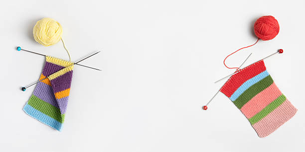 istock Ball of thread with knitting needles and knitted fabric 2212438298