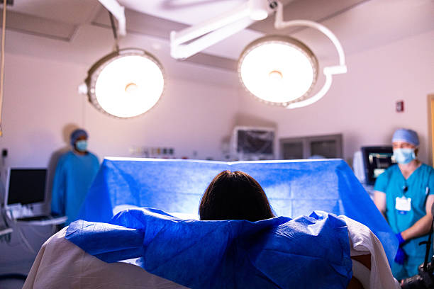 istock A woman being prepared for surgery 2212442028