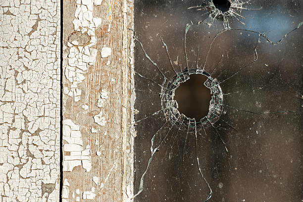 Stone hole in the window glass.Abstract cracked texture.