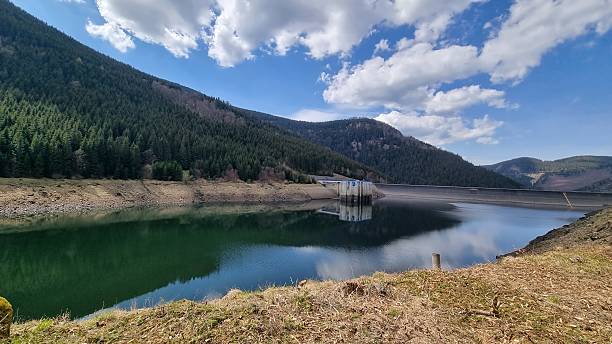 istock Beautiful Mountain Landscape with a Reservoir Under a Clear Blue Sky 2212442291