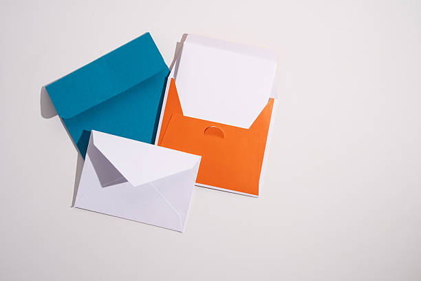 istock Paper envelopes on a light background. New mail, write a message. Send and receive mail. Postal delivery service. Empty envelope, empty space. Communication with people, paperwork. Envelope close-up 2212445076