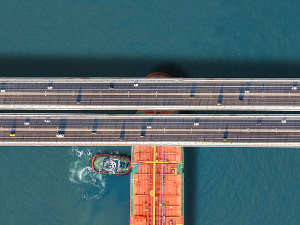 istock Crude oil tanker ship passing under bridge traffic at Istanbul Bosphorus 2212446064