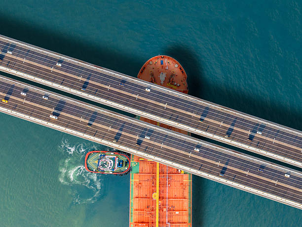 Crude oil tanker ship passing under bridge traffic at Istanbul Bosphorus
