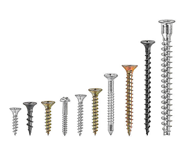 Set of various screws isolated on a white background. Self-tapping screws, black, white, gold color, galvanized screw and zinc-aluminum coated.