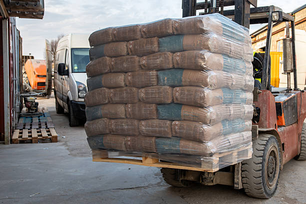 istock Forklift Transporting Pallet with Bags in Industrial Work Area 2212448839
