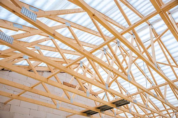 istock Construction Site Interior with Wooden Trusses and Concrete Walls 2212448862