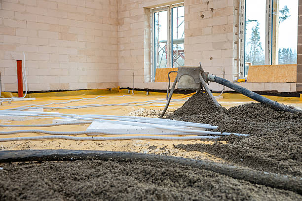 istock Interior Under Construction with Concrete Pouring and Large Windows 2212448925