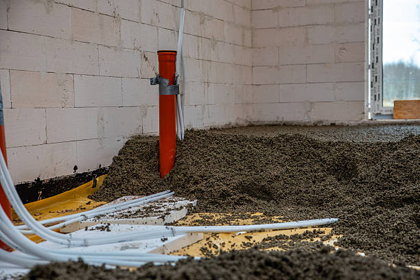 istock Construction Site Interior with Concrete Walls and Orange Pipe 2212449007