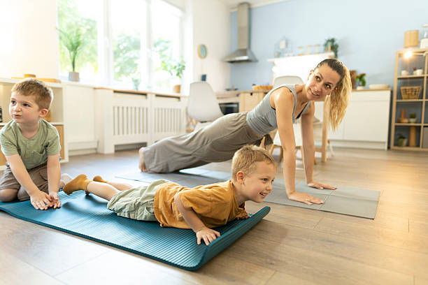 istock Two toddler practicing yoga with their mom 2212450196