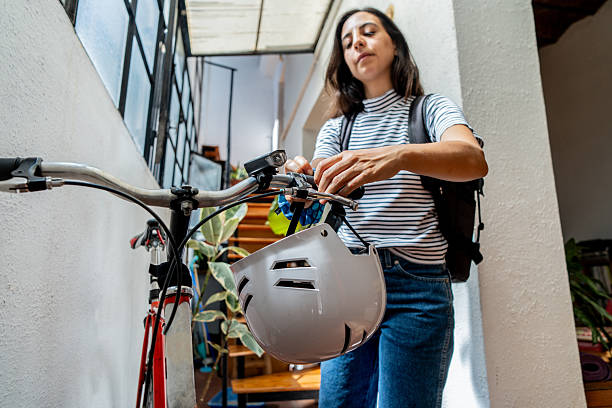 istock Mid adult student getting ready to leave home with a bicycle 2212450629