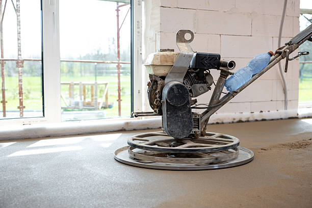 istock Power Trowel Smoothing Concrete Flooring in Construction Site 2212451373