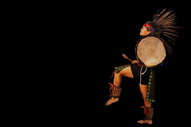 istock Mexican dancer performing traditional pre-hispanic dance with drum 2212452260