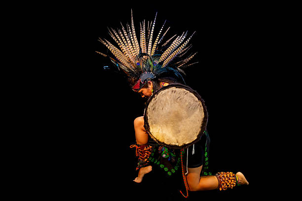 istock Mexican dancer performing traditional pre-hispanic dance with drum 2212452418