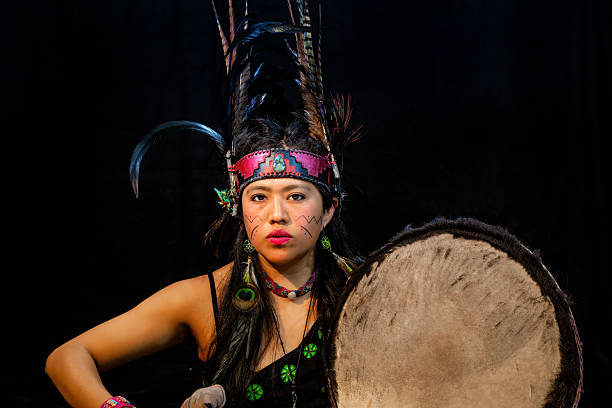 istock Mexican dancer performing a pre-hispanic ritual with drum and feathers 2212452956