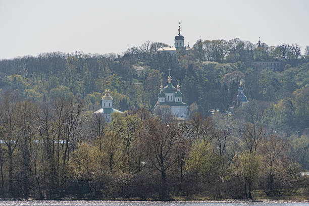 istock Peaceful landscape with water, reeds, Russian architecture structures, pastel colors, soft shadows, warm tones, no people, naturalistic style 2212457392