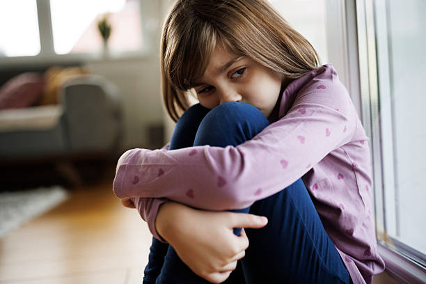 istock Sad lonely little girl 2212458423